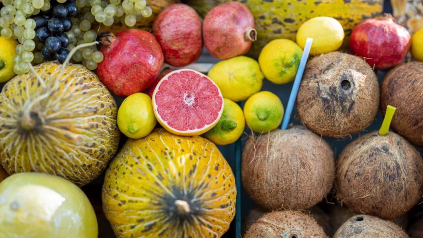 Colorful mix of tropical fruits including coconuts, citrus, and more for healthy, refreshing nutrition.